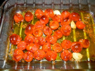 Red Cherry tomatoes make a delicious roasted tomato sauce. Wash the tomatoes, peel a few cloves of garlic, and mix with a few tablespoons of olive oil. Sprinkle with salt and roast at 400 degrees for 20 minutes. Stir, then return to the oven for another 20 minutes. The tomatoes will collapse, brown a bit and the juice will start to carmelize. Serve over pasta as is, or blend half the tomatoes and thicken with pasta water, then add pasta to the pan and stir to coat.